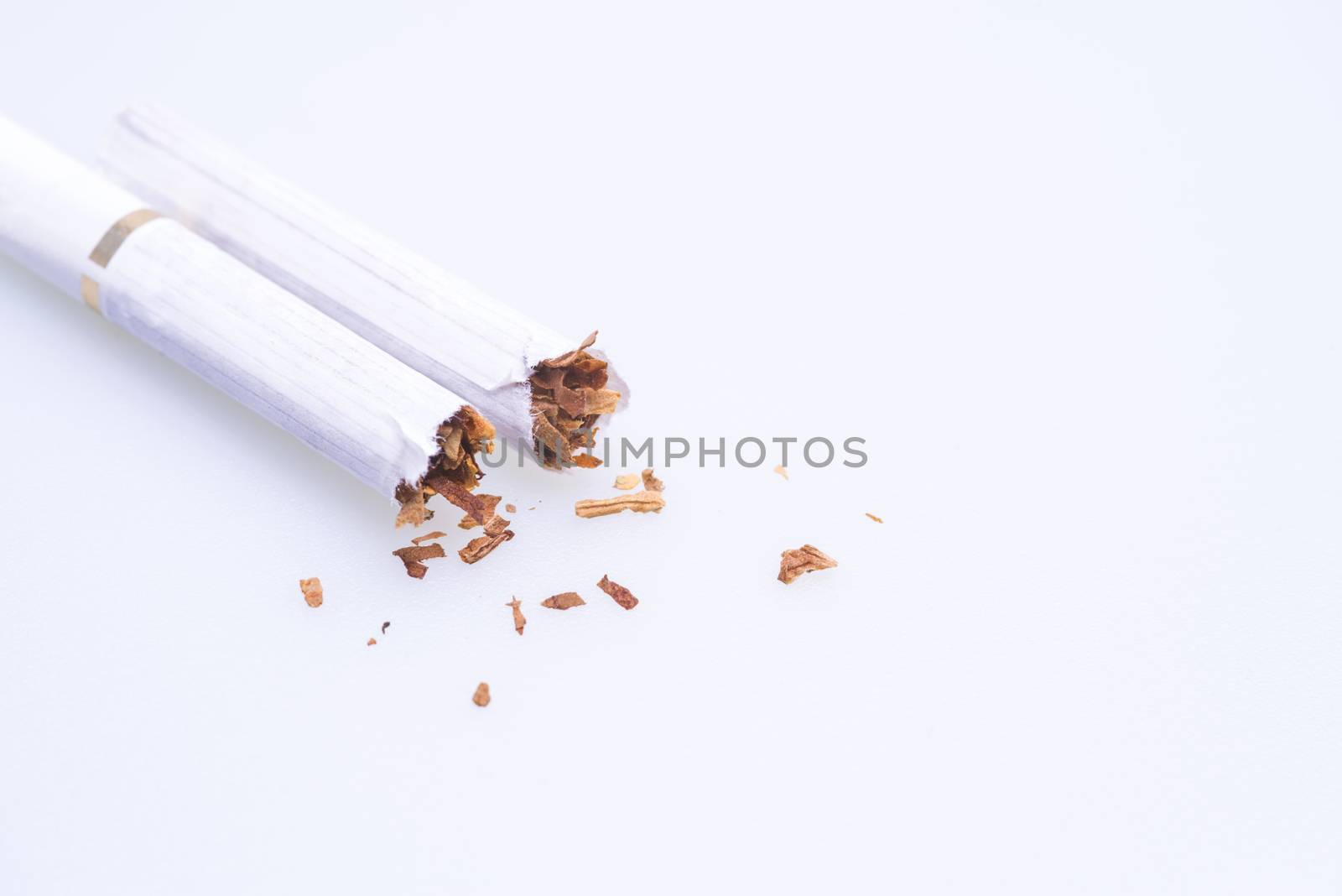 Stop smoking campaign concept, broken cigarette over white