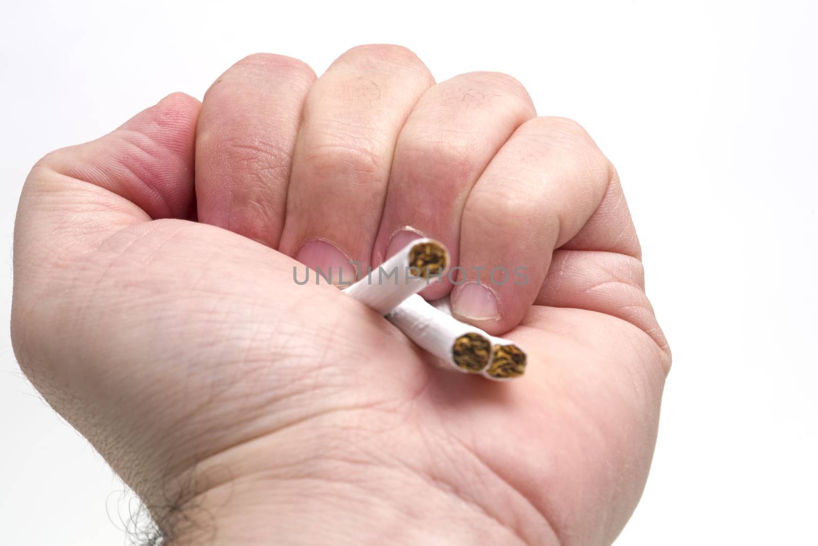 Man hand crushing the cigarettes over a white background