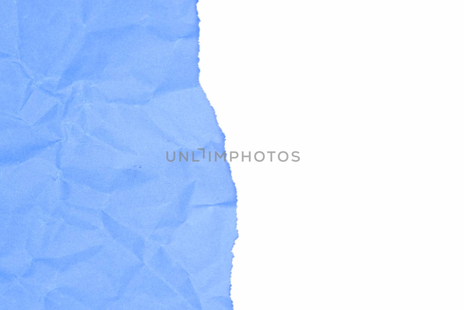 White ripped papper and blue crumpled background