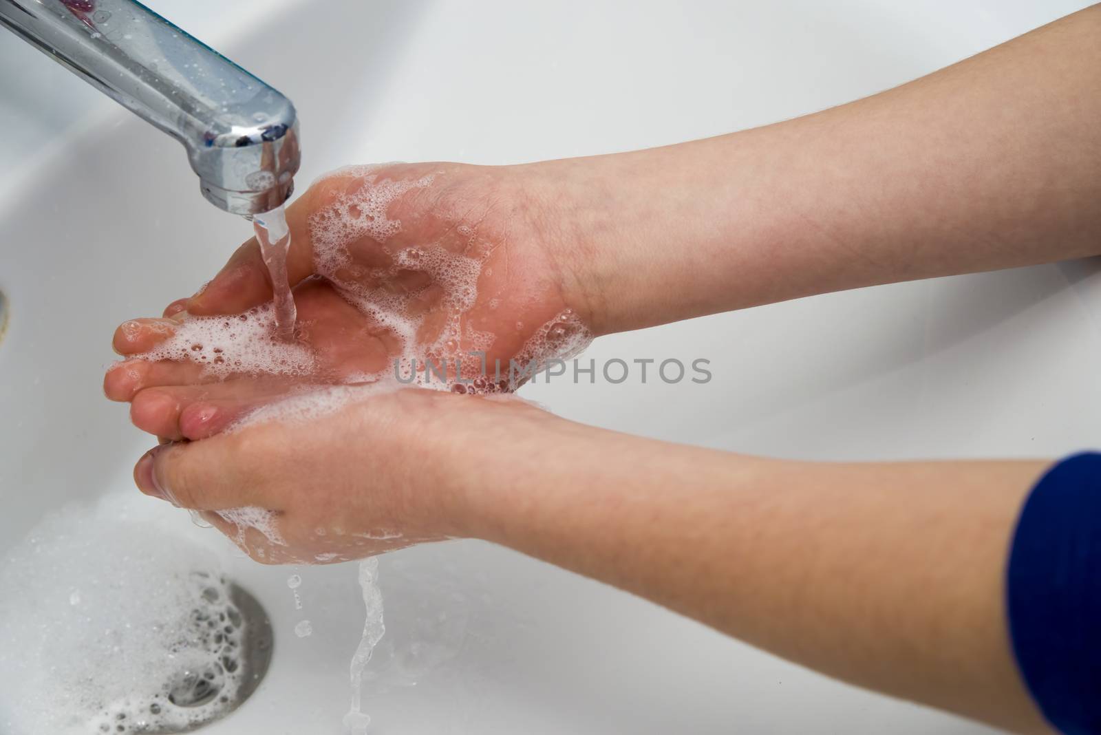 Coronavirus pandemic prevention, hands washing with soap