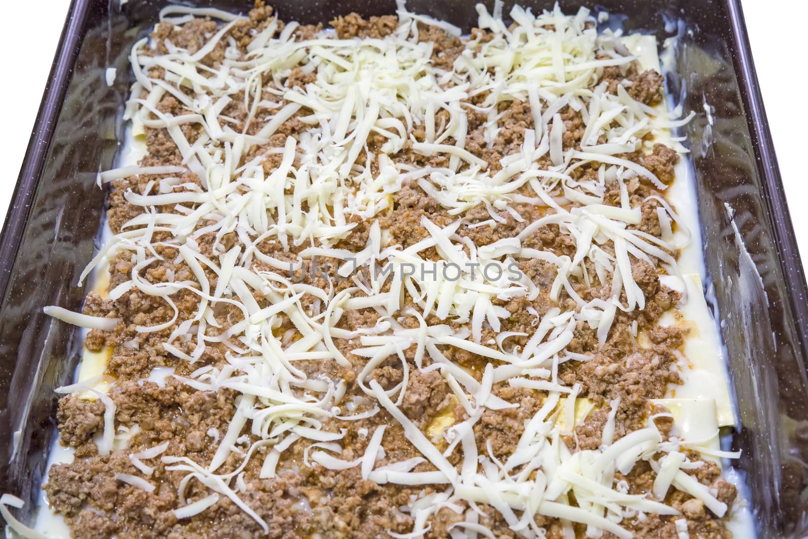 Tray with homemade lasagna ready to be cooked