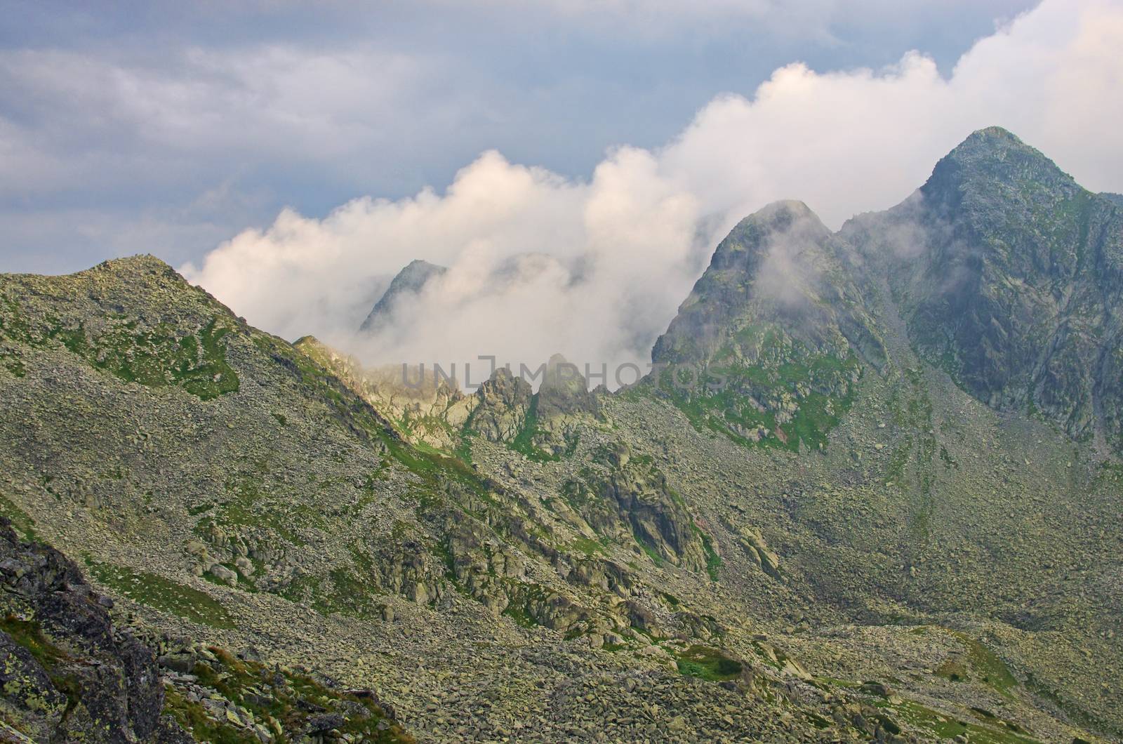 Mountain crest and peaks in clouds, Romanian Carpathians summer  landscape