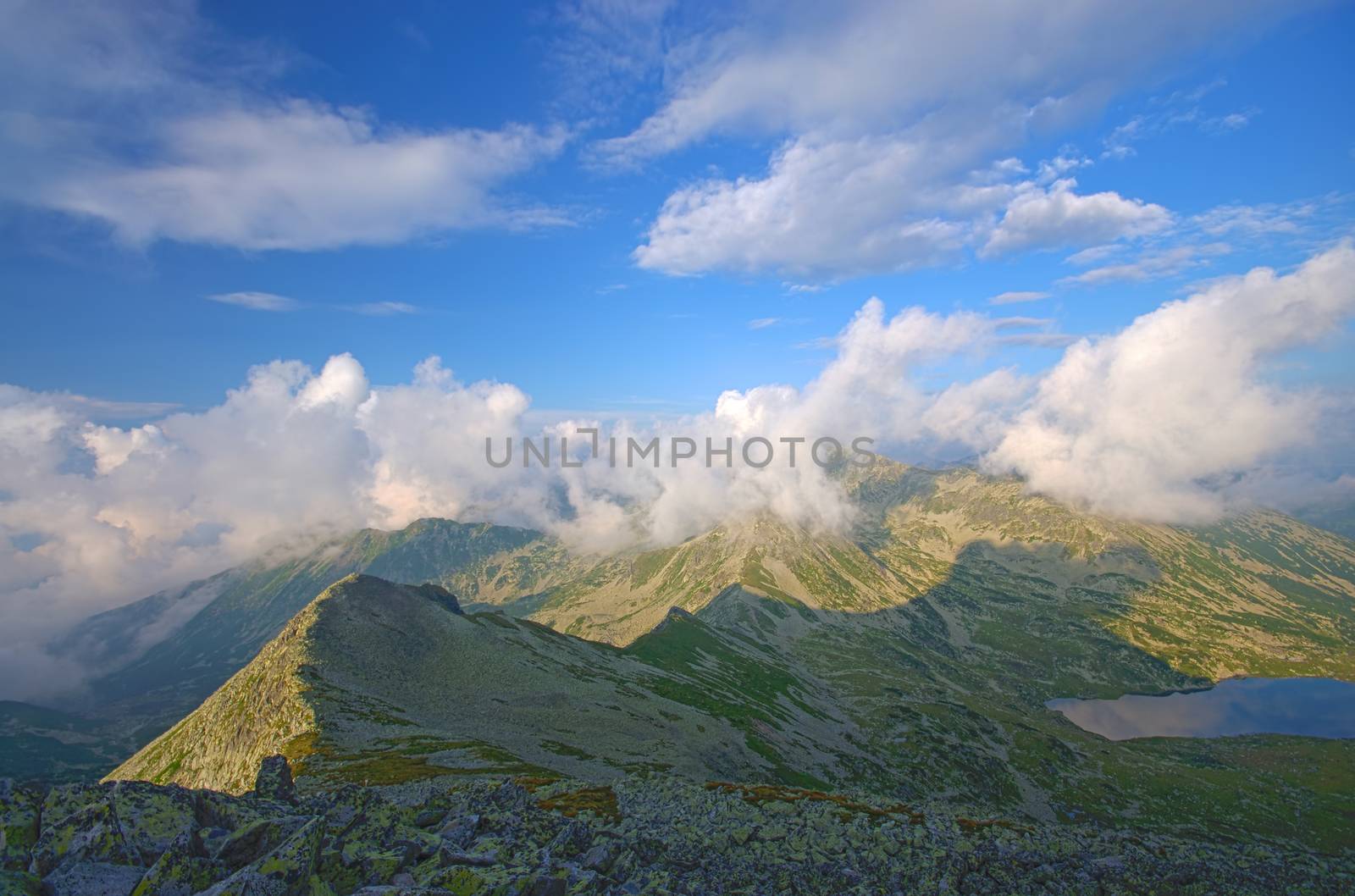 Summer crest with clouds in Romanian Carpathians landscape