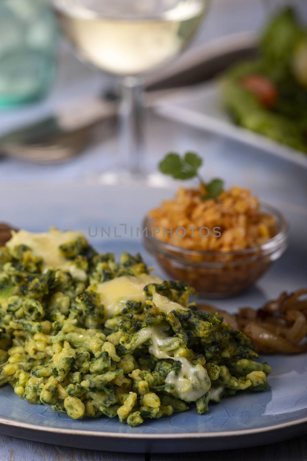 bavarian spinach spaetzle on a plate by bernjuer