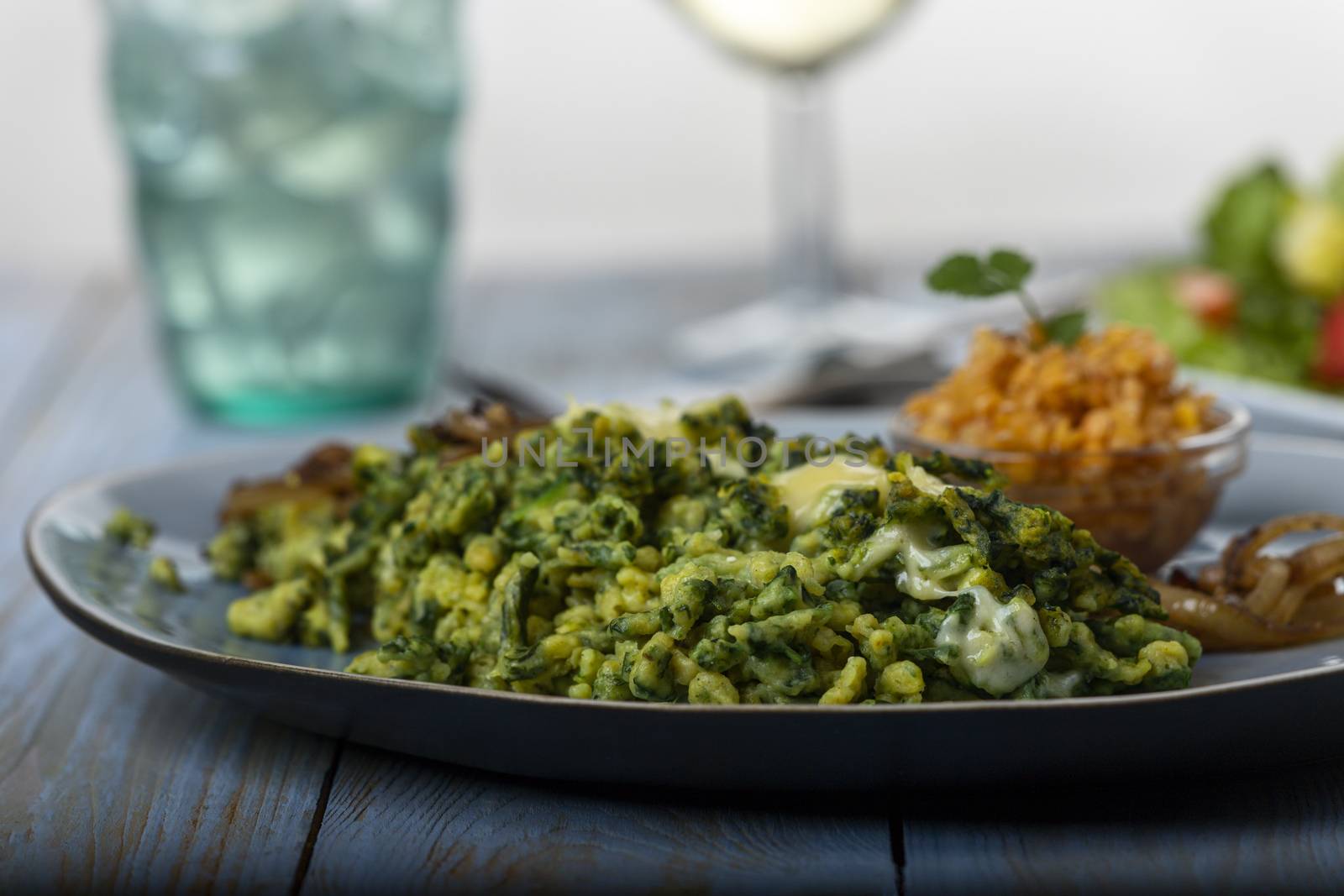 bavarian spinach spaetzle on a plate by bernjuer