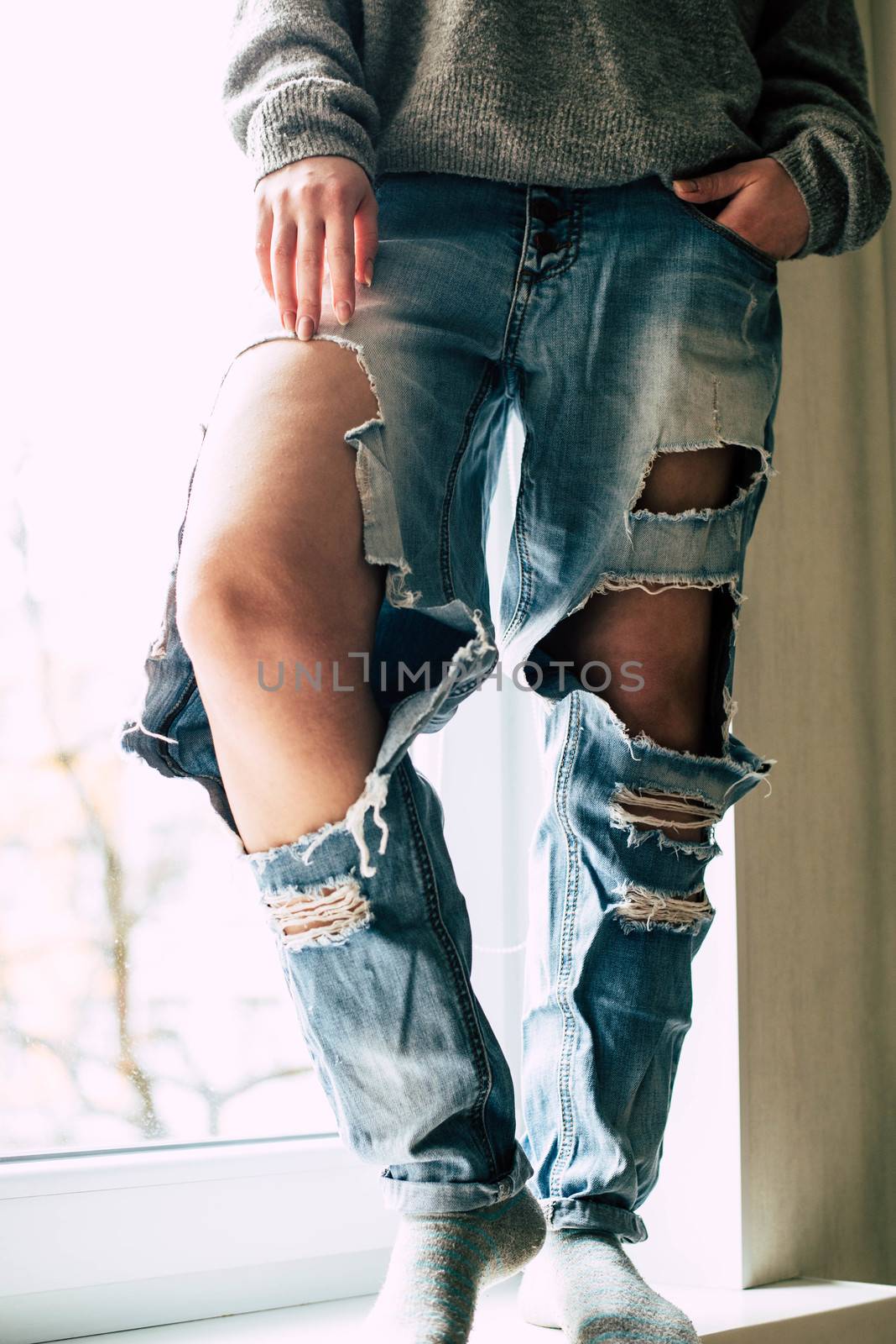 Girl in torn jeans