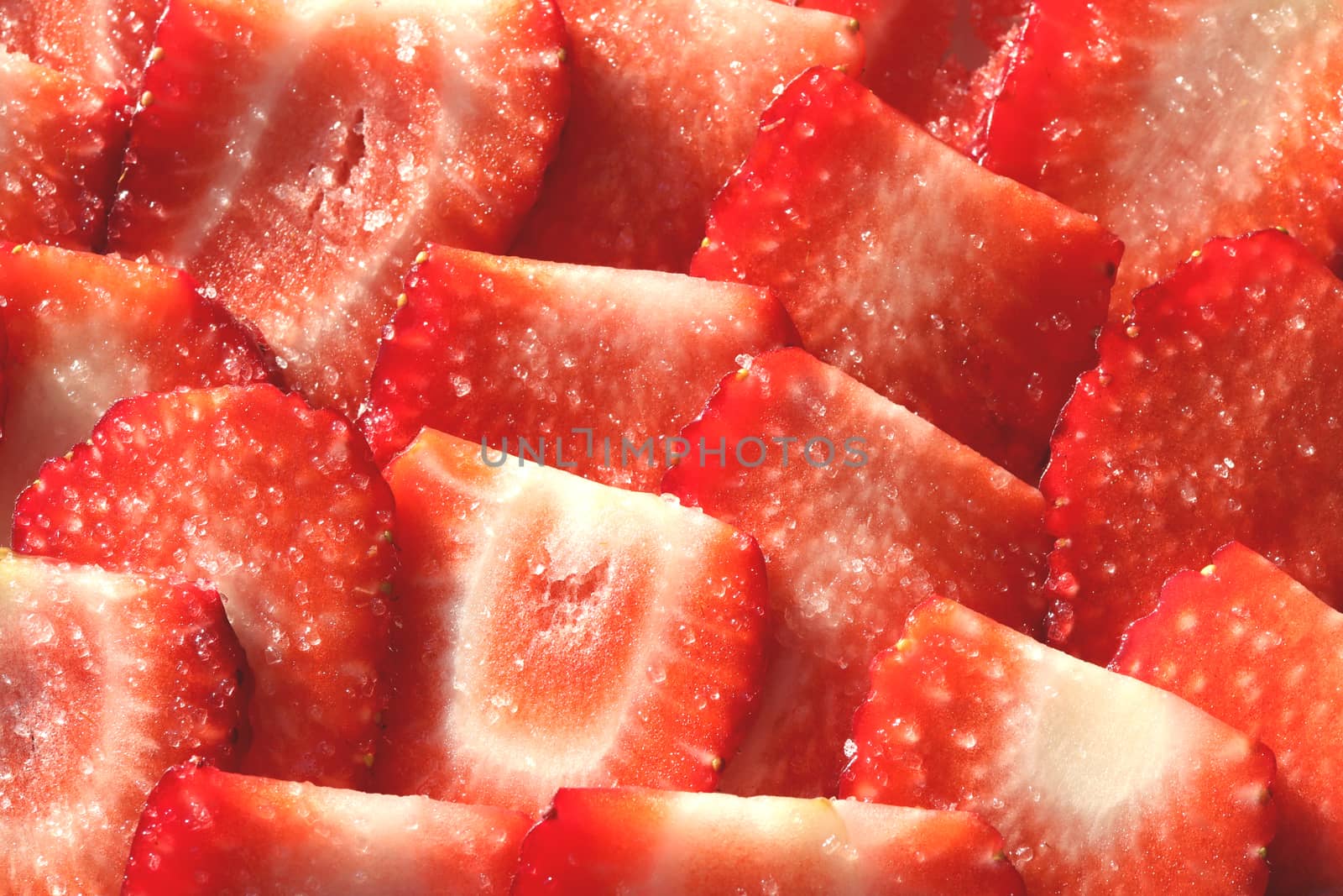 Vitamin berry backdrop. Strawberry slices in sugar filling background. Strawberry with sugar texture.