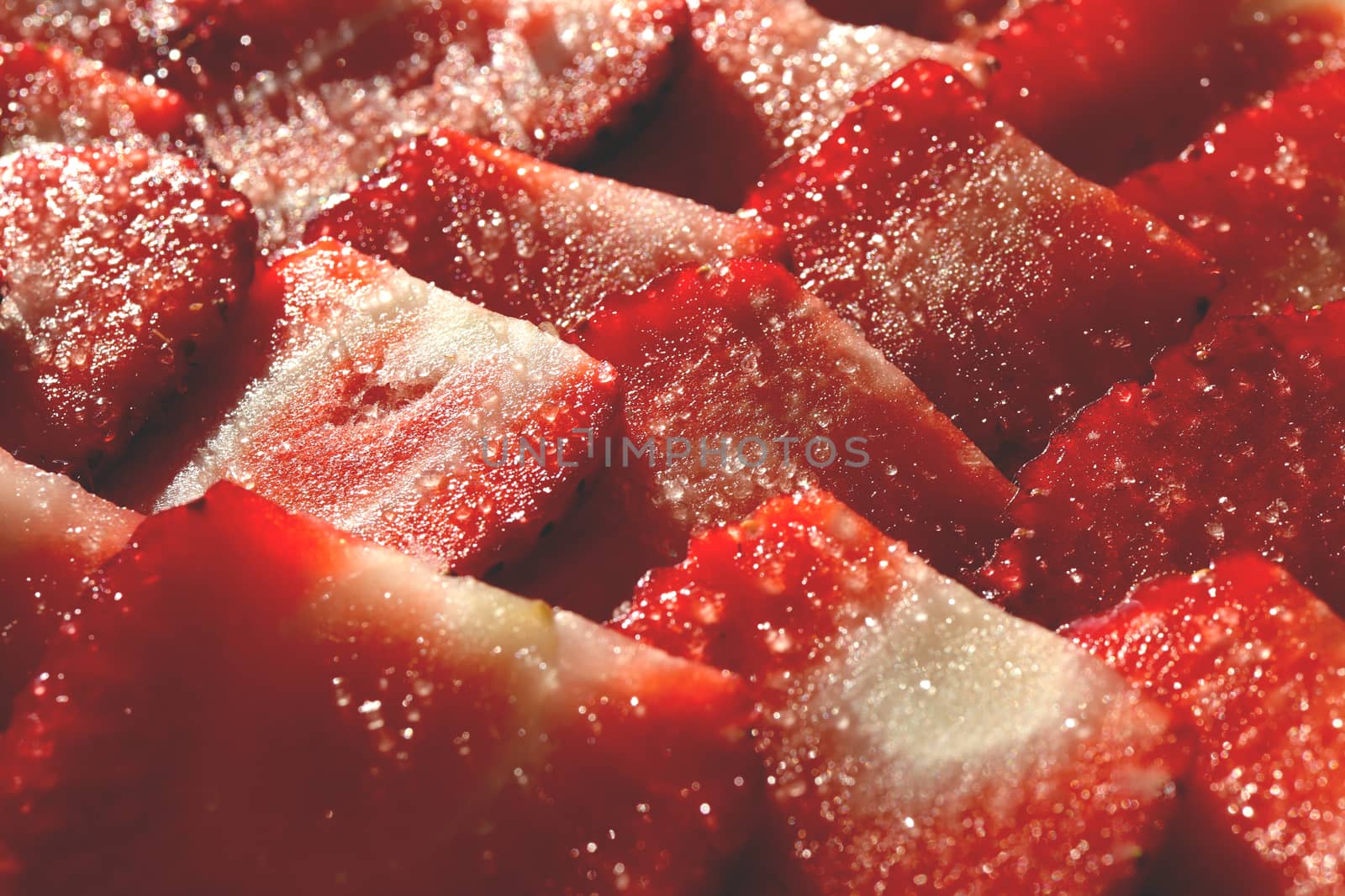 Strawberry with sugar texture. Vitamin berry backdrop. Strawberry slices in sugar filling background. by sanches812