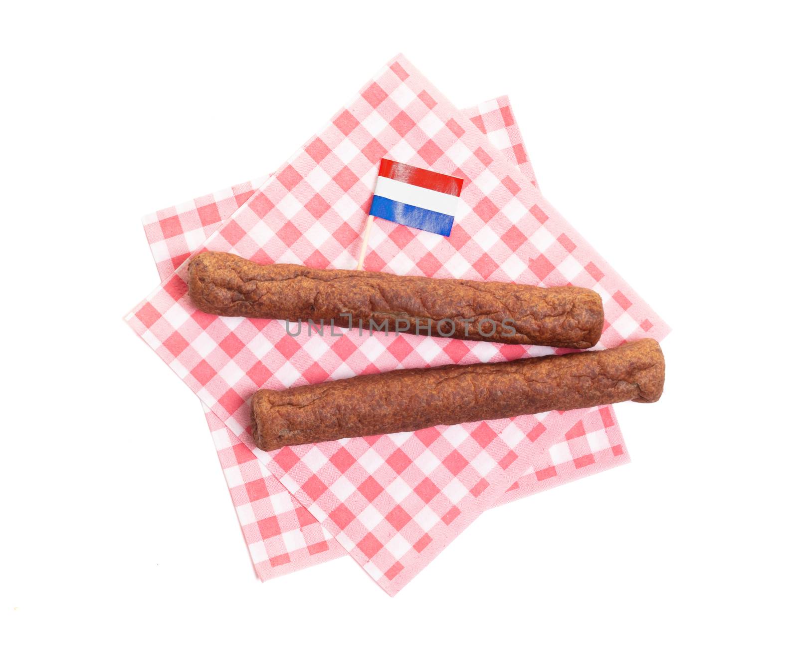 Two frikadellen on a napkin, a Dutch fast food snack, isolated