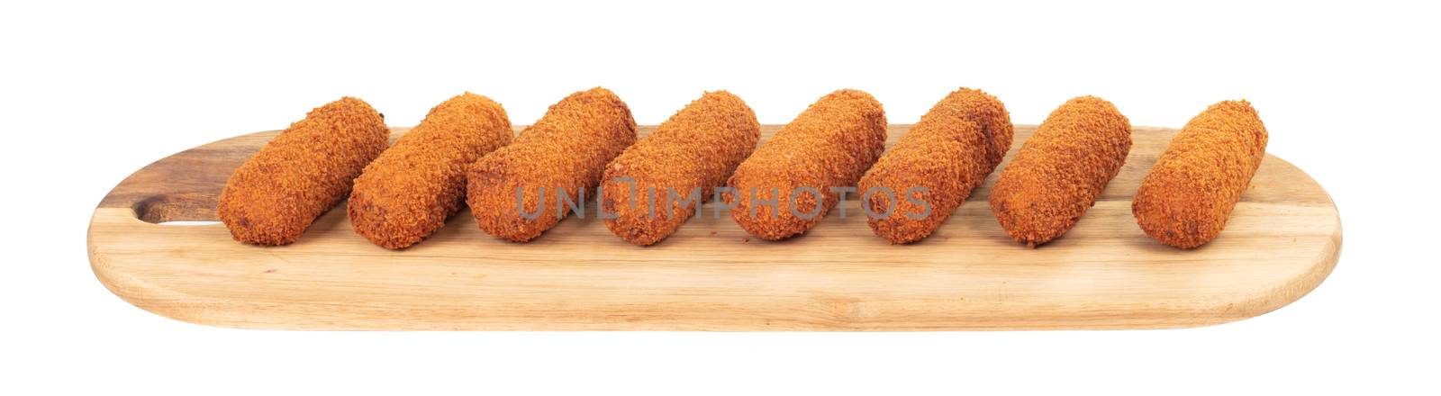 Brown crusty dutch kroketten on a serving tray, isolated on a white background