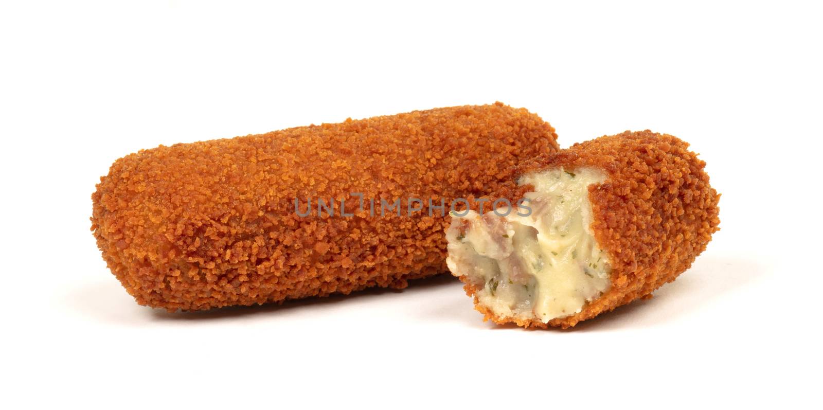 Partly eaten brown crusty dutch kroket isolated by michaklootwijk