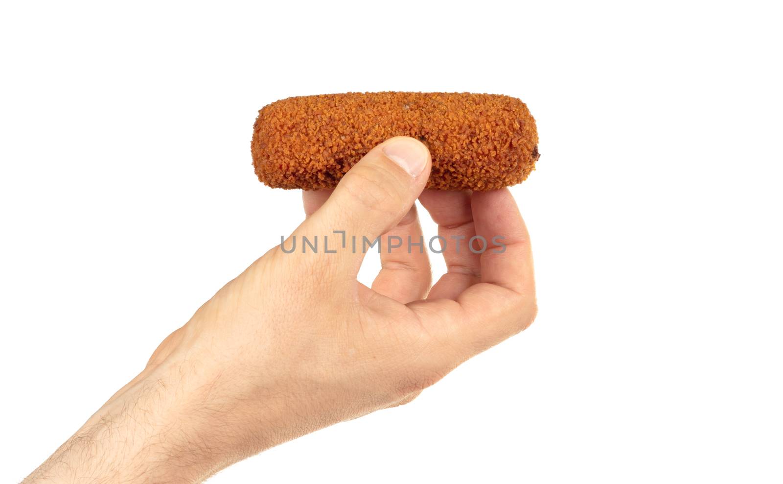 Brown crusty dutch kroket held by an adult man, isolated on a white background