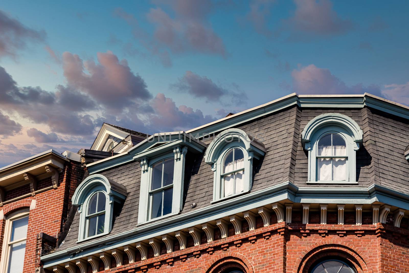 Mansard roof on an old brick building in Portland, Maine