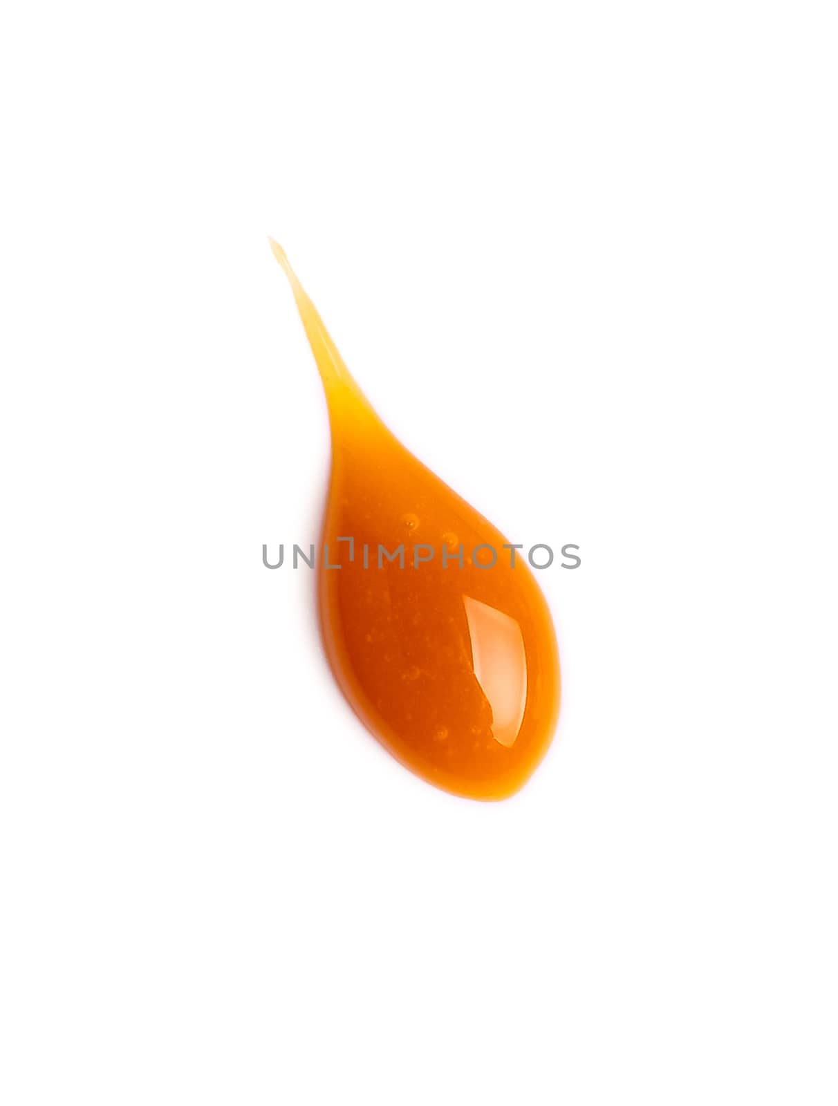 sweet caramel sauce drop isolated on white background Top view or flat lay. Caramel drop isolated on white with clipping path.