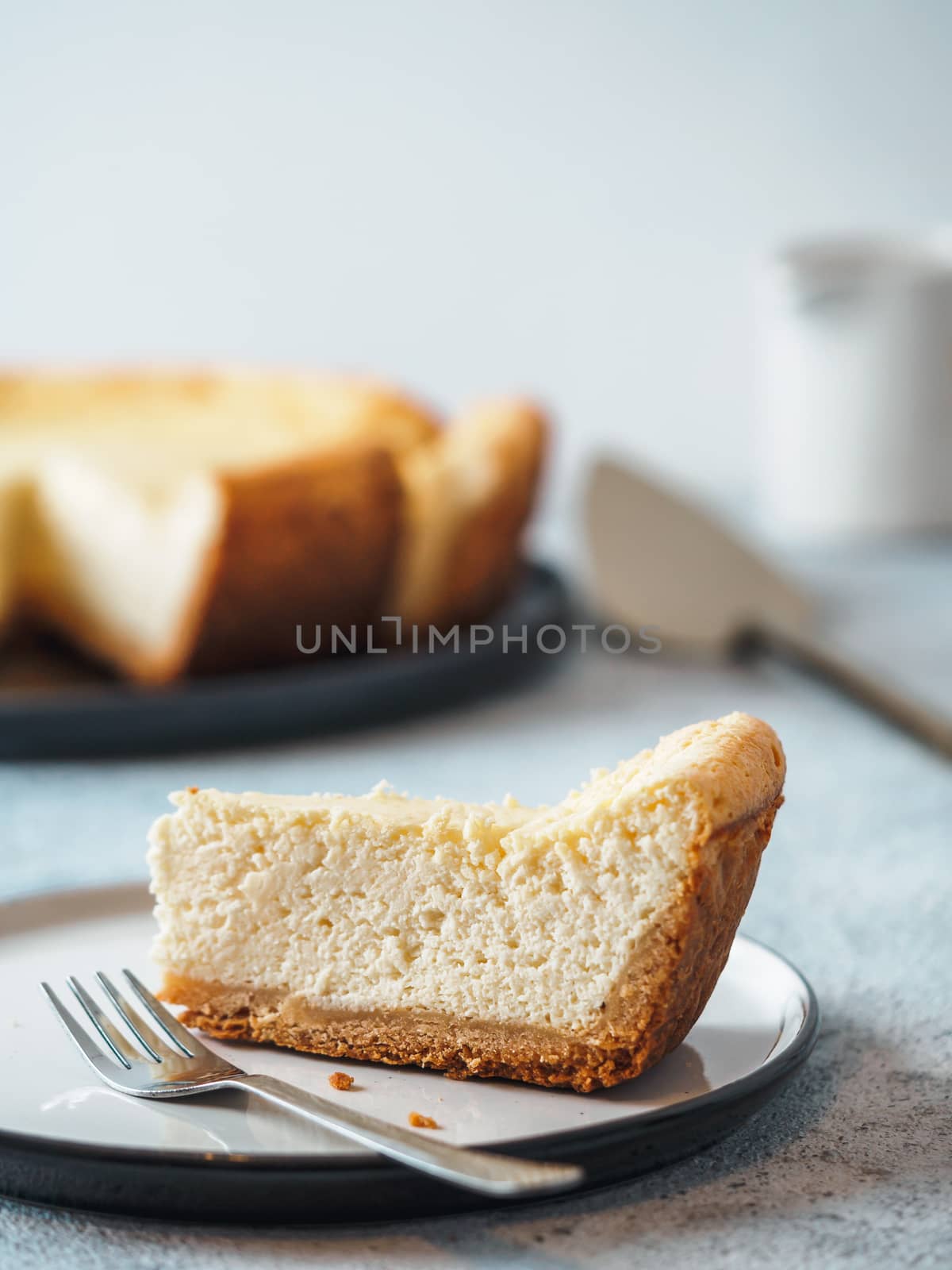 Classic Cheesecake on table, vertical by fascinadora