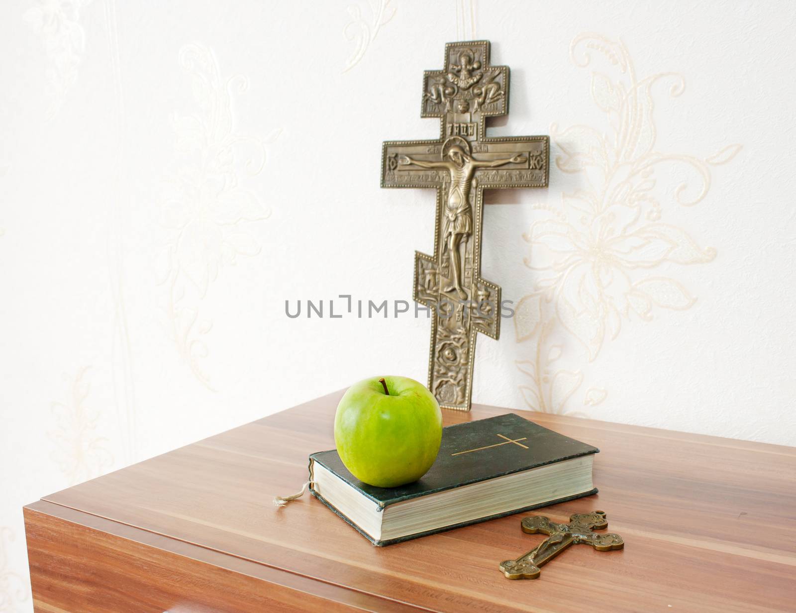 holy bible with green apple and two crosses by raddnatt