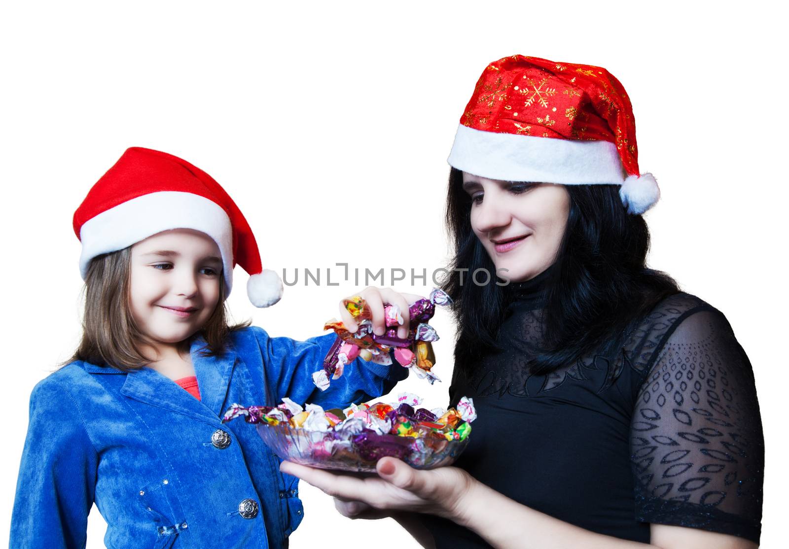 mom treats her daughter candy  in Christmas 