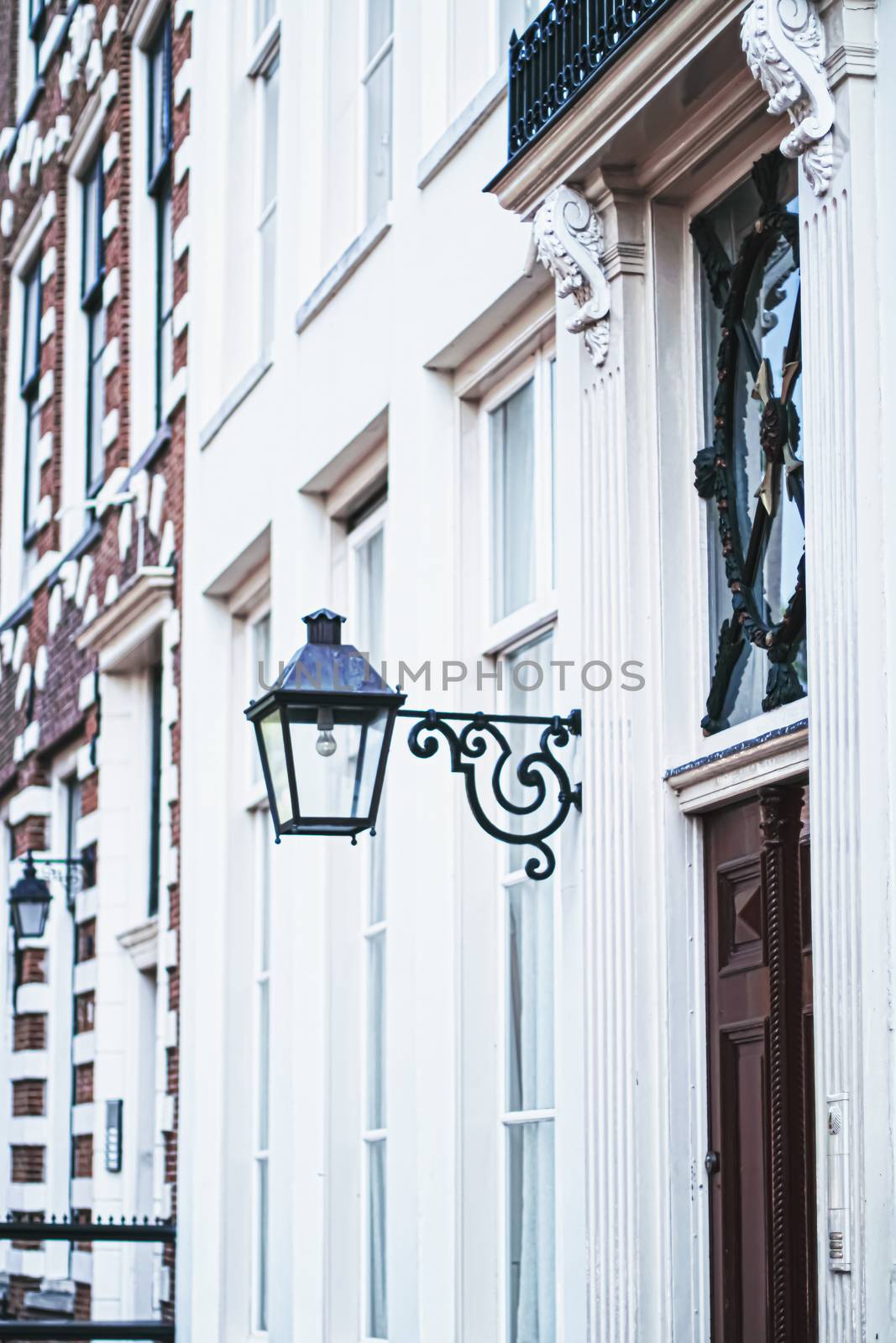 Architectural detail of a building on the main city center street of Amsterdam in Netherlands, european architecture