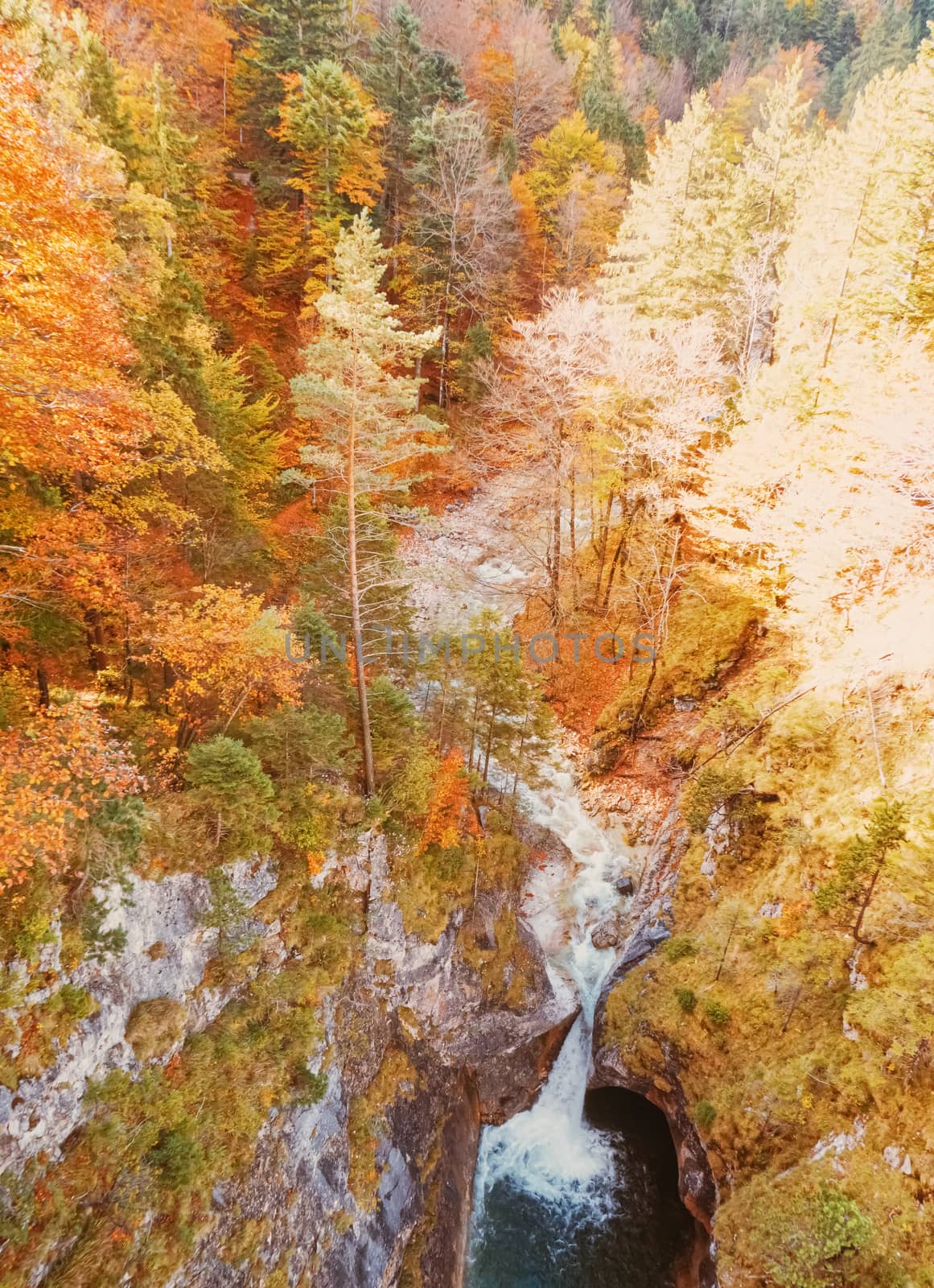 Beautiful nature of European Alps, landscape view of alpine mountains, lake and village in autumn season, travel and destination scenery