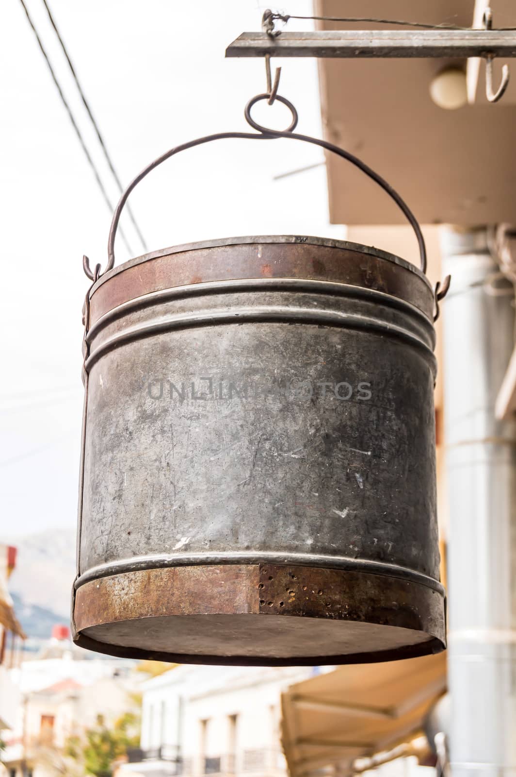 Scrap bucket hanging outside by a hook