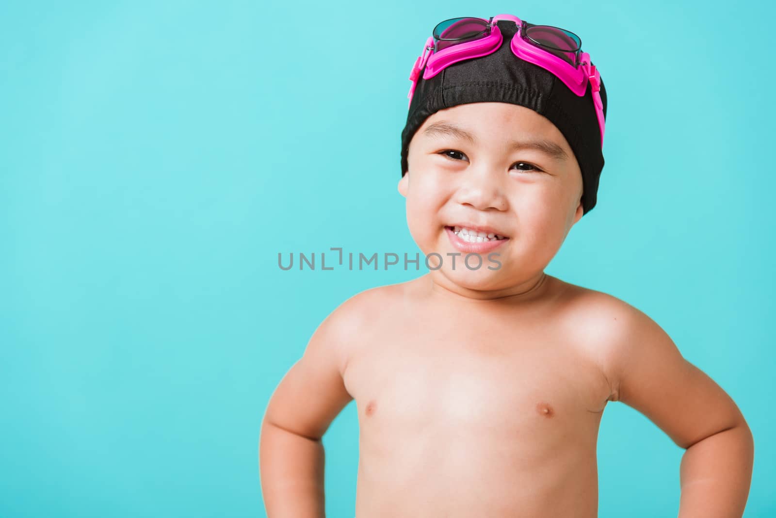little child boy wearing goggles and swimsuit by Sorapop