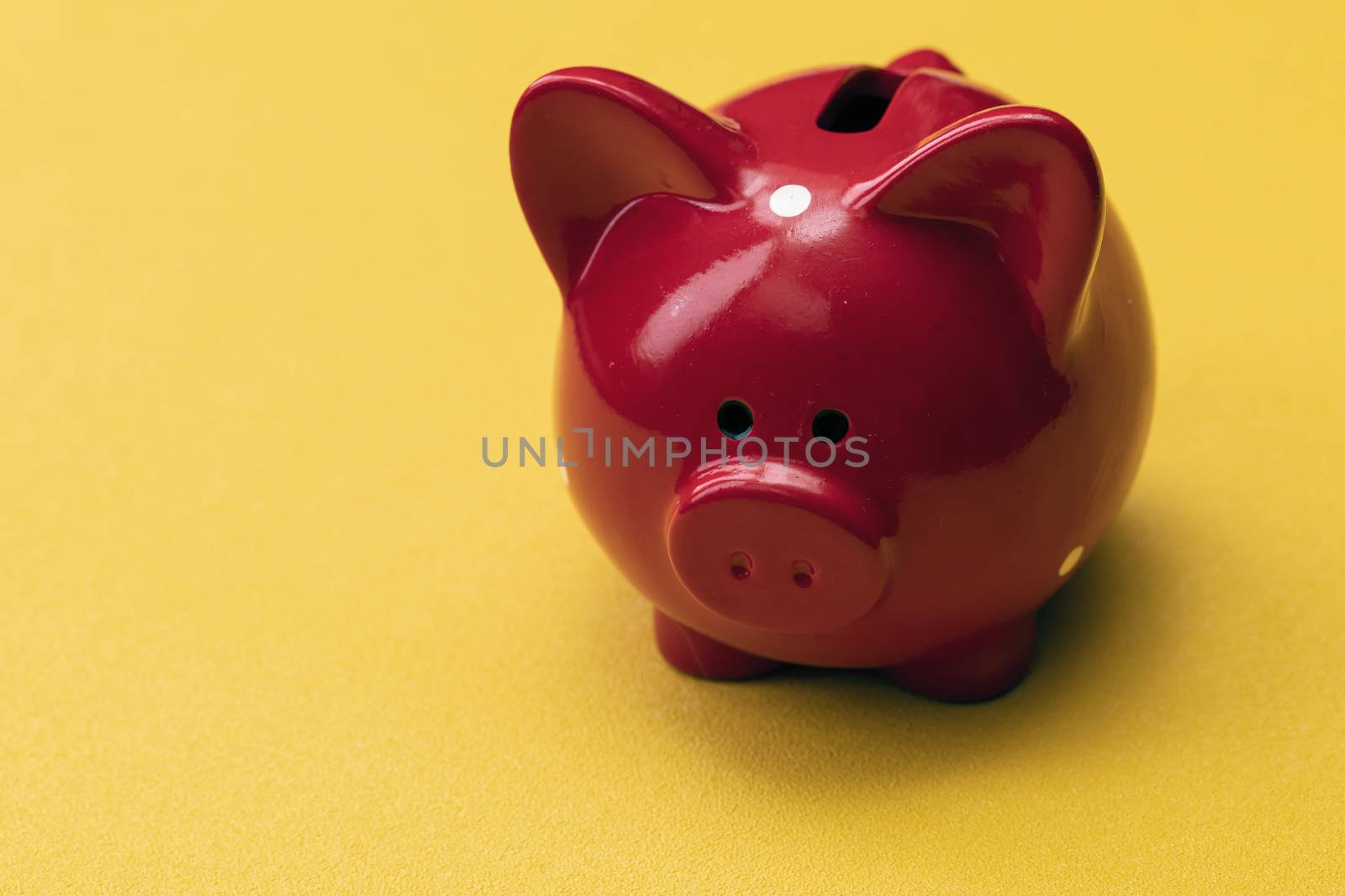 Pink piggy bank on color background. Money saving