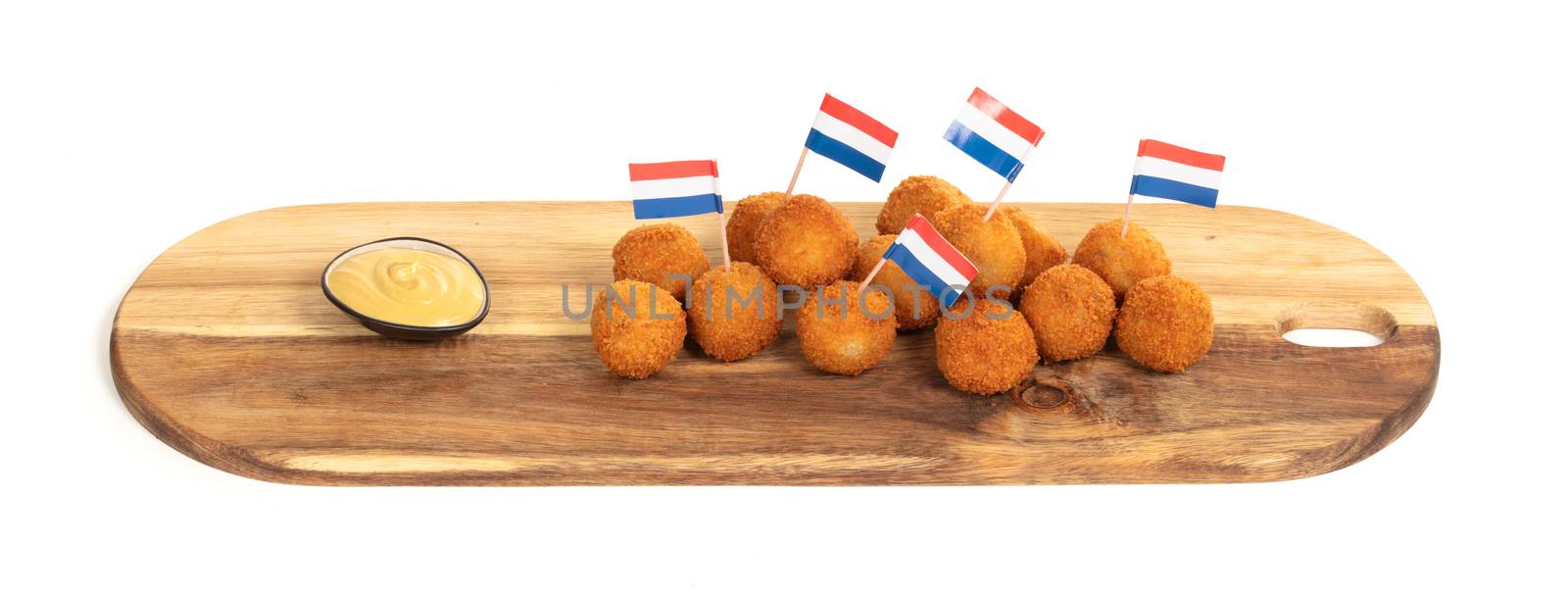 Dutch traditional snack bitterbal on a serving board, dutch flag by michaklootwijk