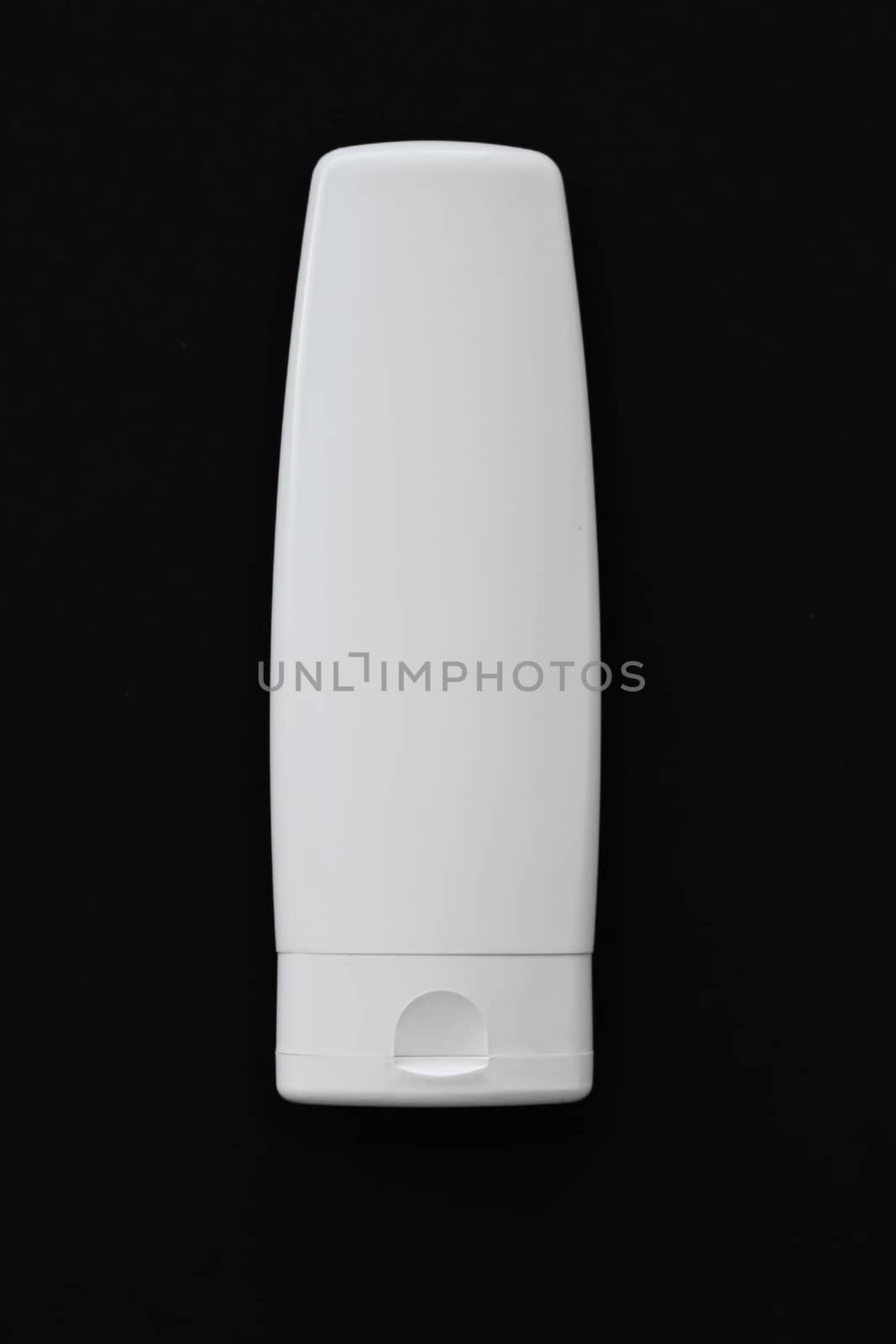 Blank label cosmetic container bottle as product mockup on black background by Anneleven