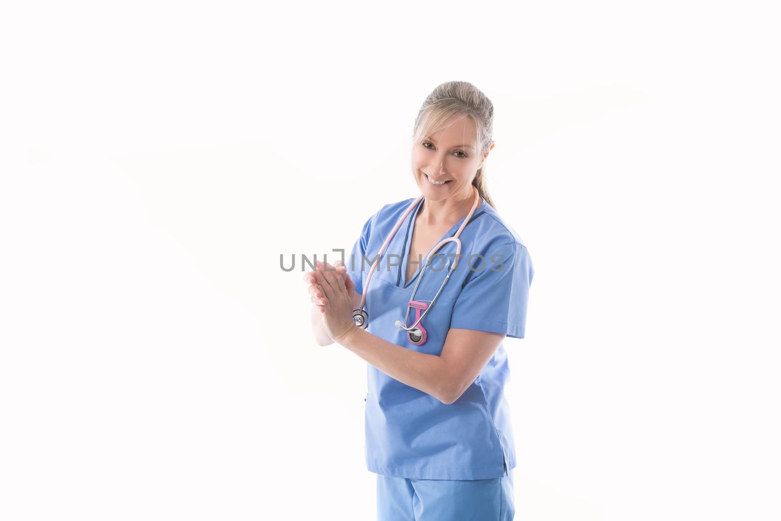 Friendly nurse using an alcohol hand sanitizer by lovleah