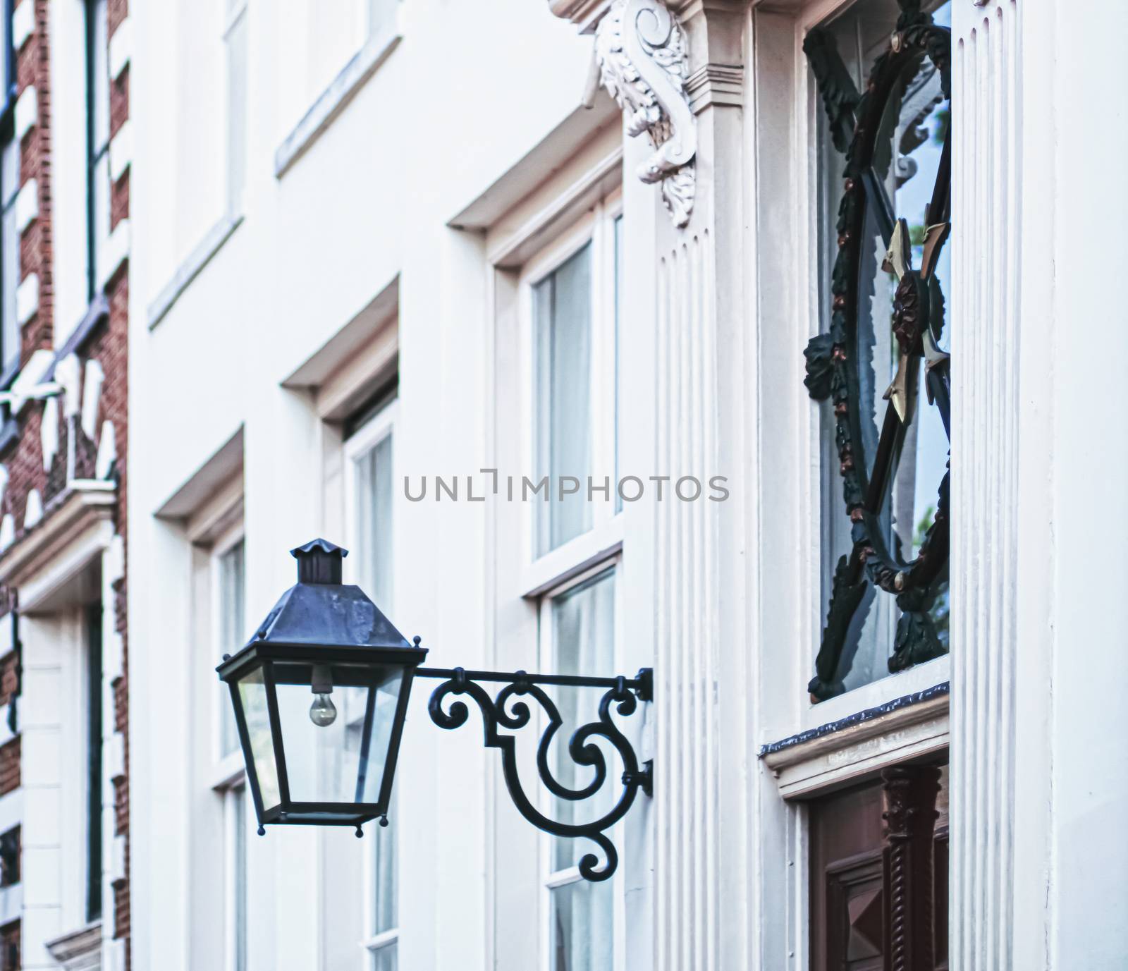 Architectural detail of a building on the main city center street of Amsterdam in Netherlands, european architecture