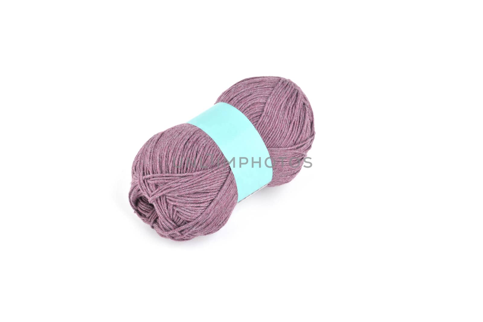 Tangle of color yarn with blank label on white background skein. Knitting isolated on white. Use for store