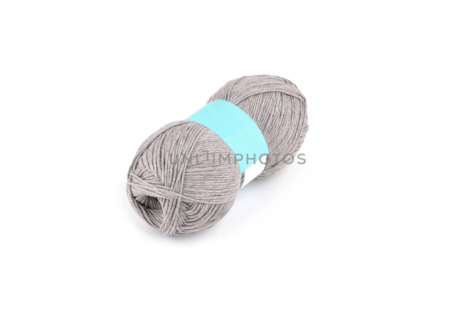 Tangle of color yarn with blank label on white background skein. Knitting isolated on white. Use for store