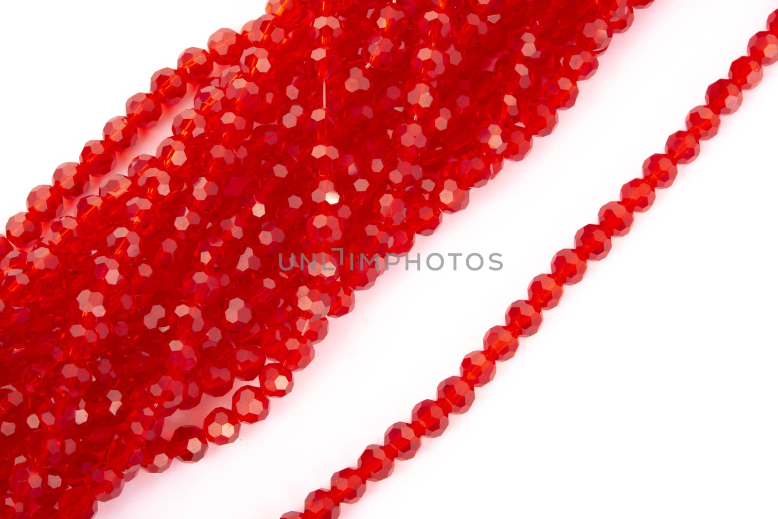 Beautiful Red Glass Sparkle Crystal Isoalted Beads on white background. Use for diy beaded jewelry