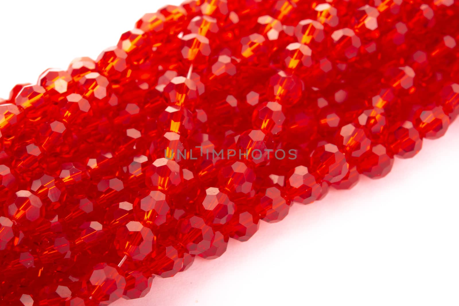 Beautiful Red Glass Sparkle Crystal Isoalted Beads on white background. Use for diy beaded jewelry