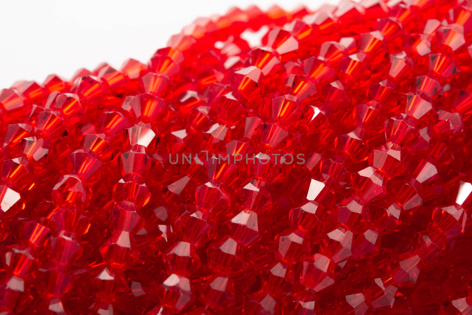 Beautiful Red Glass Sparkle Crystal Isoalted Beads on white background. Use for diy beaded jewelry