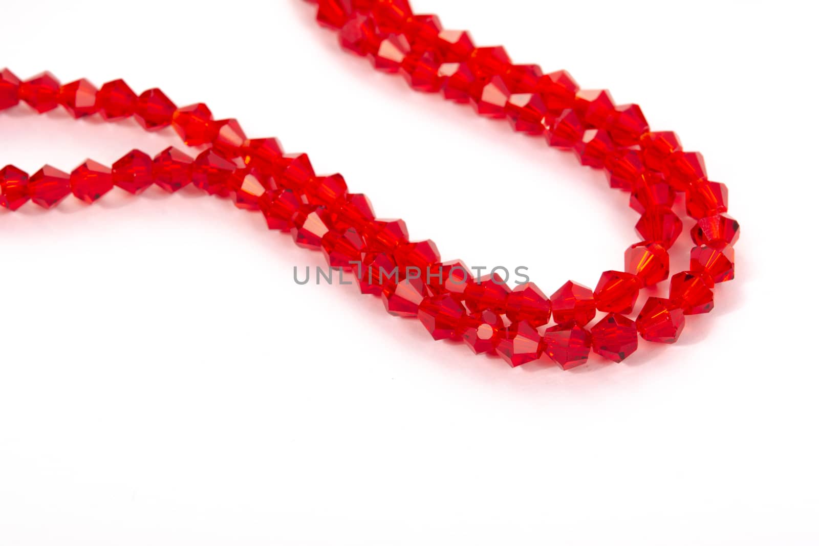 Beautiful Red Glass Sparkle Crystal Isoalted Beads on white background. Use for diy beaded jewelry