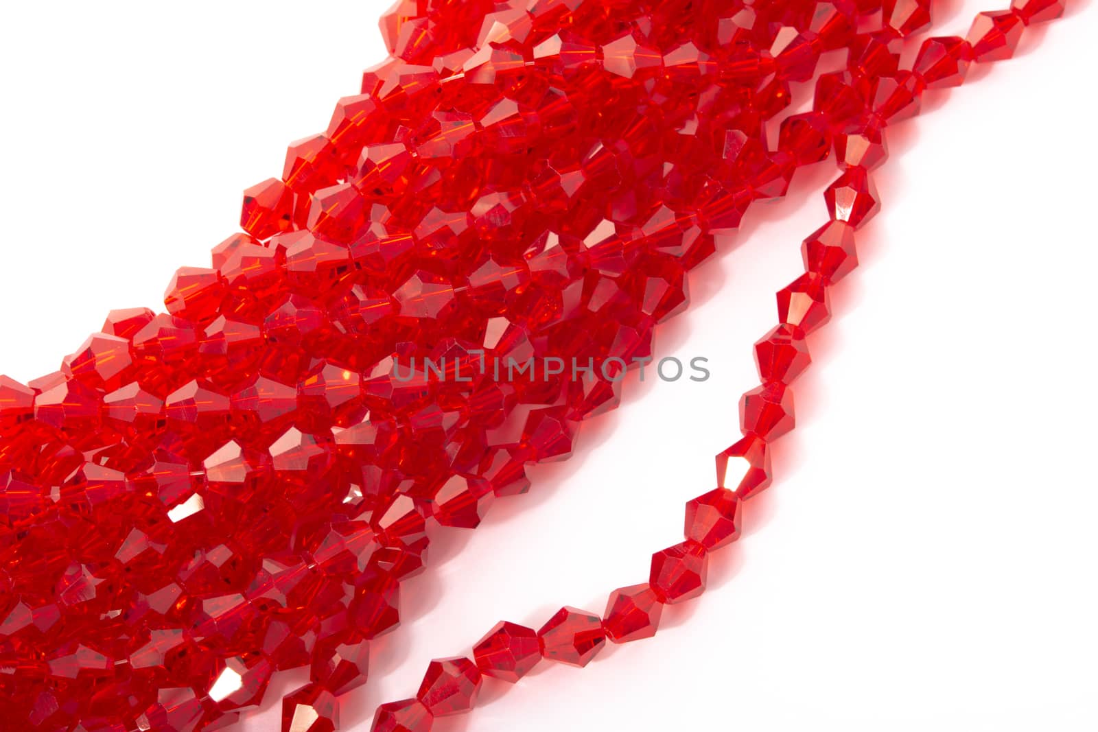 Beautiful Red Glass Sparkle Crystal Isoalted Beads on white background. Use for diy beaded jewelry