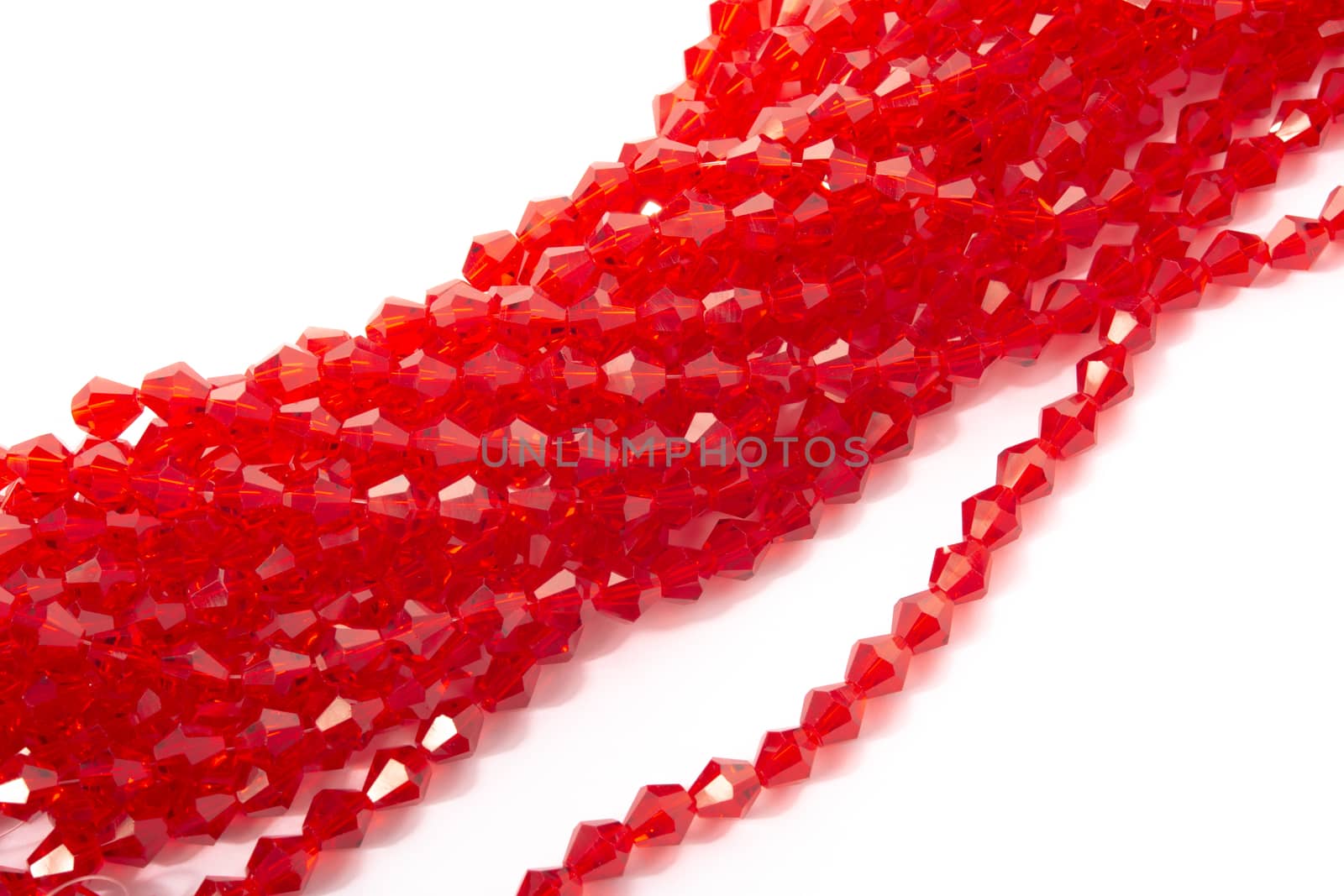 Beautiful Red Glass Sparkle Crystal Isoalted Beads on white background. Use for diy beaded jewelry