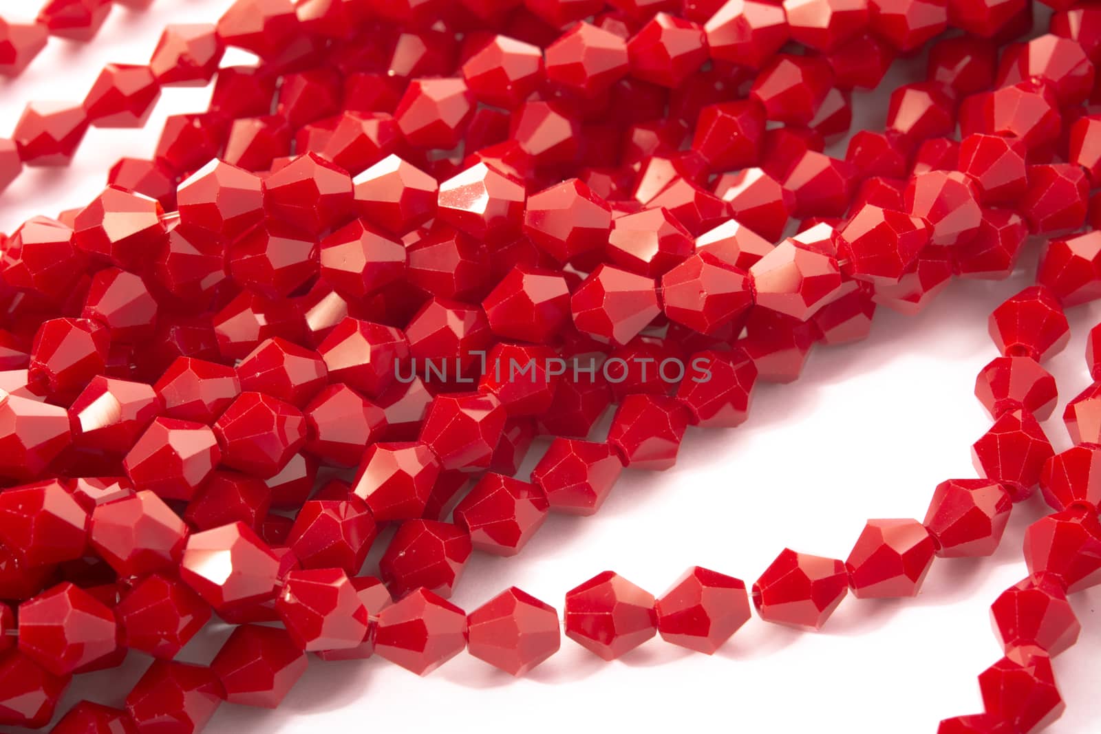 Beautiful Red Glass Sparkle Crystal Isoalted Beads on white background. Use for diy beaded jewelry
