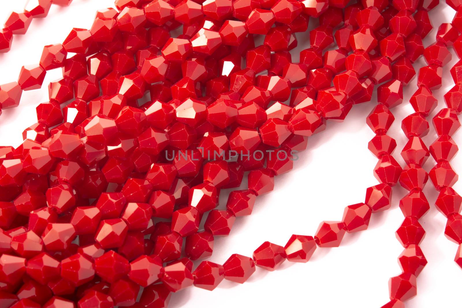 Beautiful Red Glass Sparkle Crystal Isoalted Beads on white background. Use for diy beaded jewelry