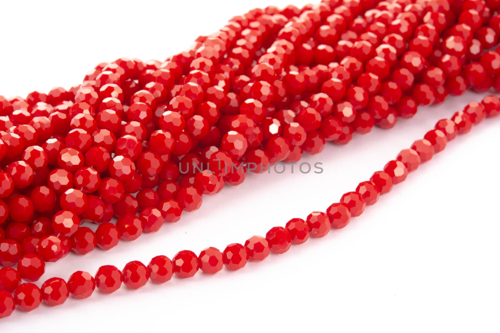 Beautiful Red Glass Sparkle Crystal Isoalted Beads on white background. Use for diy beaded jewelry