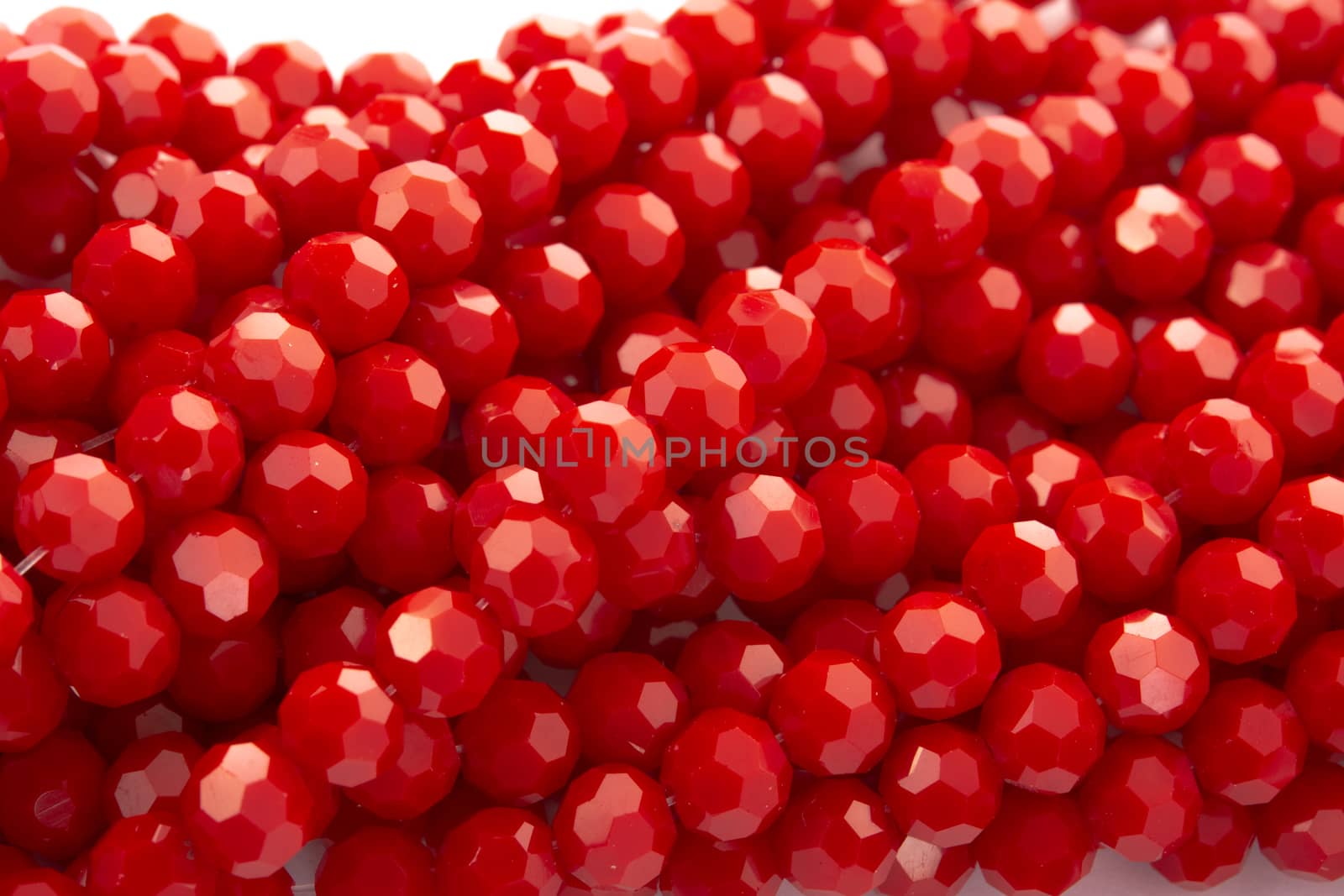 Beautiful Red Glass Sparkle Crystal Isoalted Beads on white background. Use for diy beaded jewelry