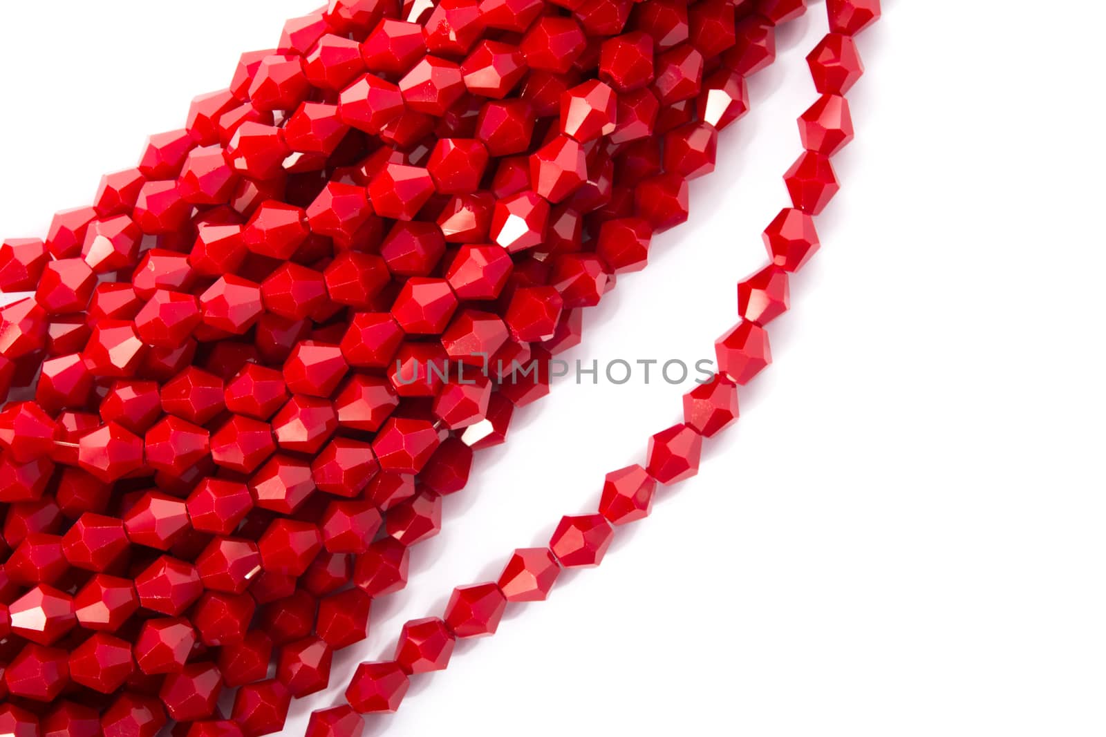 Beautiful Red Glass Sparkle Crystal Isoalted Beads on white background. Use for diy beaded jewelry