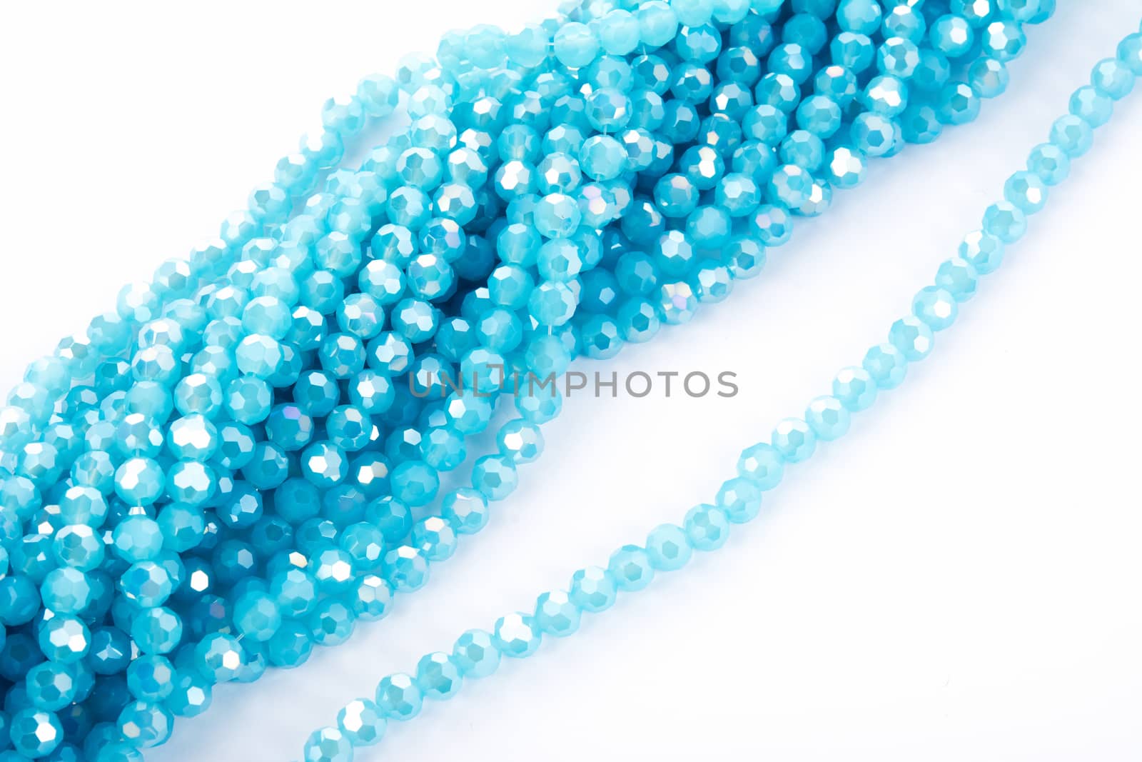 Beautiful Light Blue Glass Sparkle Crystal Isoalted Beads on white background. Use for diy beaded jewelry