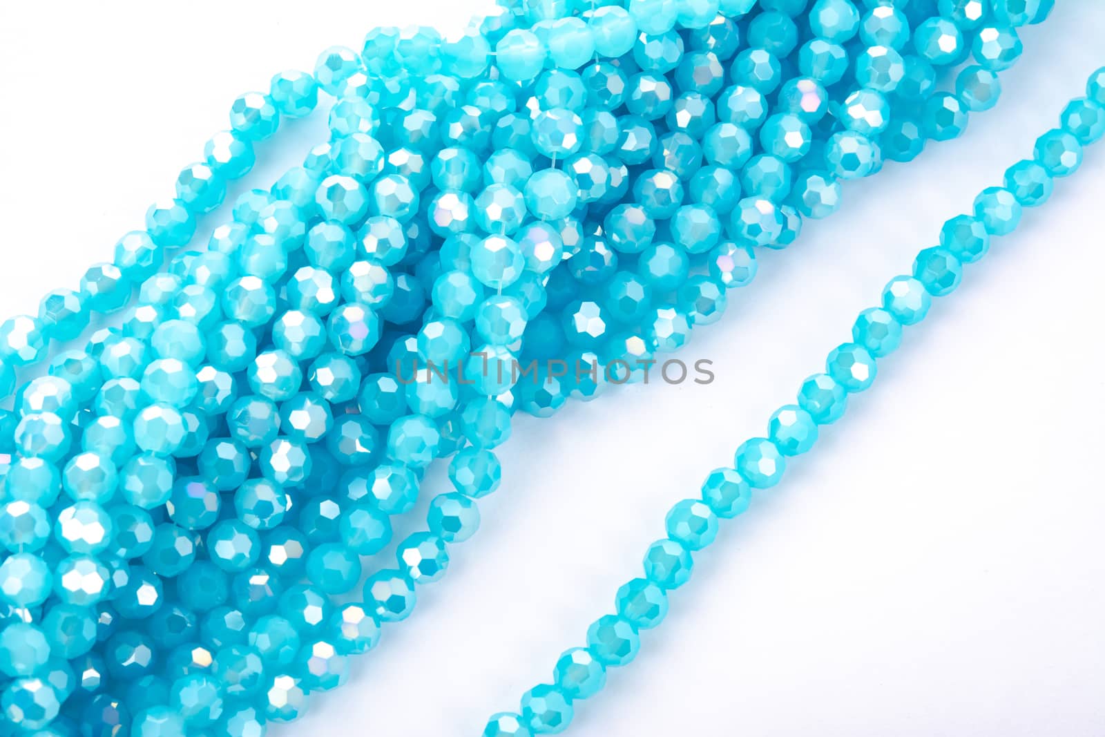 Beautiful Light Blue Glass Sparkle Crystal Isoalted Beads on white background. Use for diy beaded jewelry