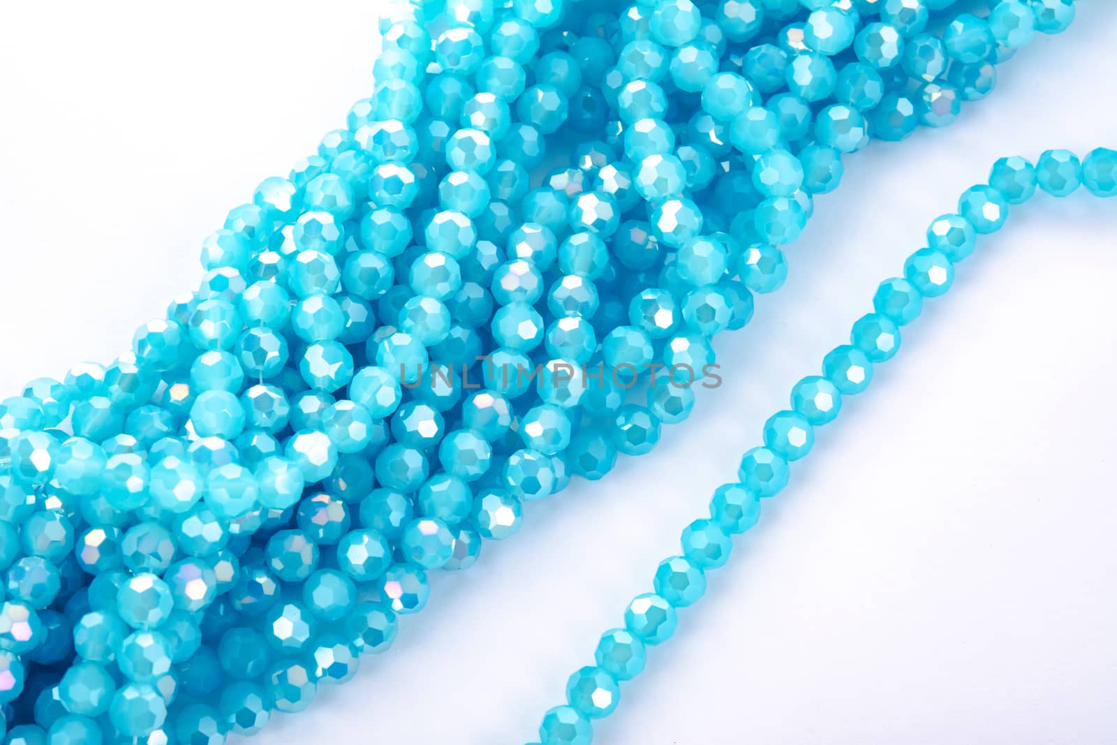 Beautiful Light Blue Glass Sparkle Crystal Isoalted Beads on white background. Use for diy beaded jewelry