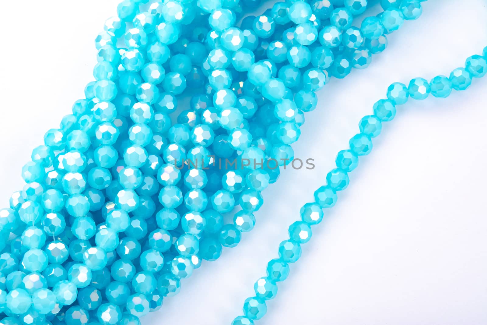 Beautiful Light Blue Glass Sparkle Crystal Isoalted Beads on white background. Use for diy beaded jewelry