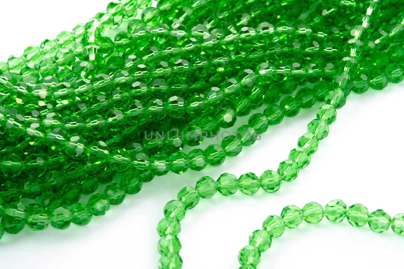 Beautiful Light green Glass Sparkle Crystal Isoalted Beads on white background. Use for diy beaded jewelry