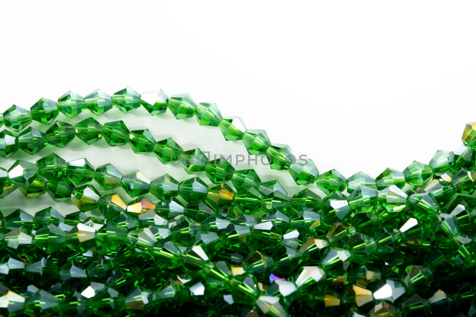 Beautiful Light green Glass Sparkle Crystal Isoalted Beads on white background. Use for diy beaded jewelry