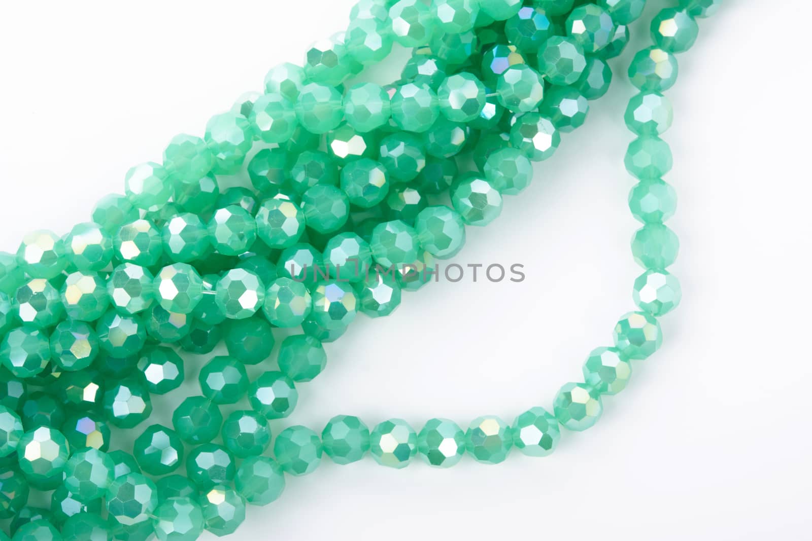 Beautiful Light green Glass Sparkle Crystal Isoalted Beads on white background. Use for diy beaded jewelry